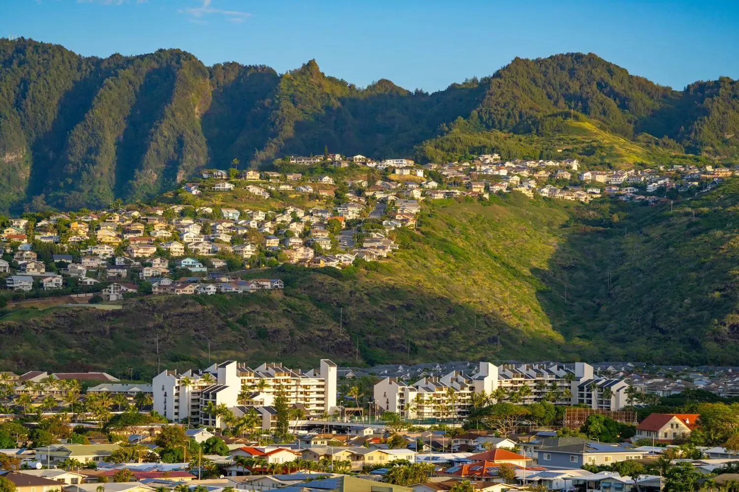 Homes along the water in Hawaii Kai with Koko Head behind them